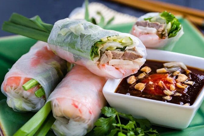 12 Tasting Street Food & Sightseeing By Scooter with Student - Nguyễn Thiện Thuật apartment buildings: old Saigon architecture and a pagoda visit