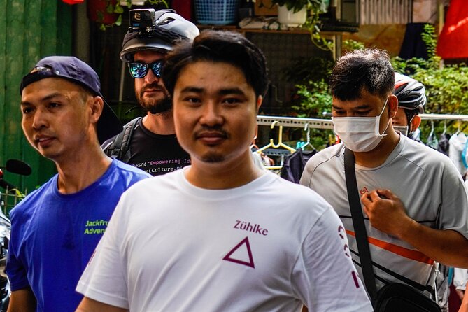 Half Day - Saigon Off-the-Beaten-Path - City Cycling Tour - District 10: a slower pace, Umbrella Market time, and 1968 apartments