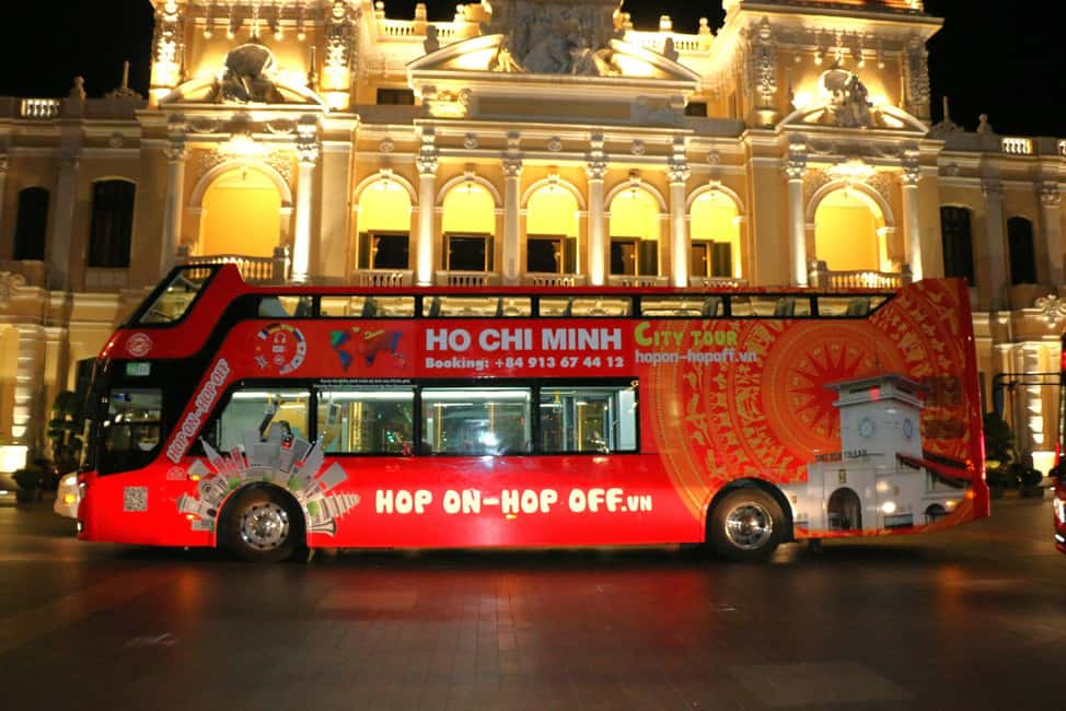 Ho Chi Minh City: Late-Night Open-Top Bus Tour - Entering Late-Night Saigon from a Red Open-Top Double-Decker
