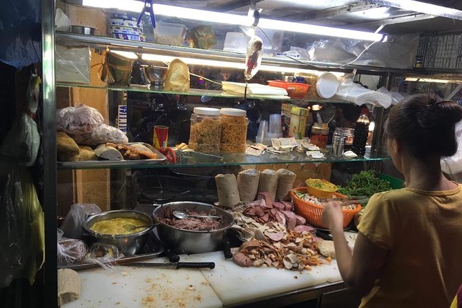 Ho Chi Minh City: Street Food Walking Tour with 12 Tastings - Getting around: scooter pickup, helmet safety, and transfers