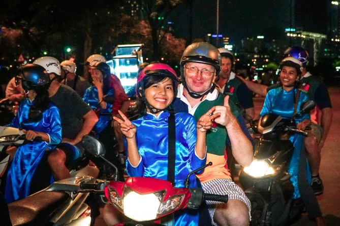 Ho Chi Minh Night Tour by Motorbikes with Female Rider | KissTour - Ho Thị Kỷ flower market: color, snacks, and real-night energy