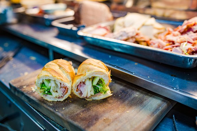 Private Street Food Evening Walking Tour in Ho Chi Minh City - Beyond dinner: flower market nights and lotus details