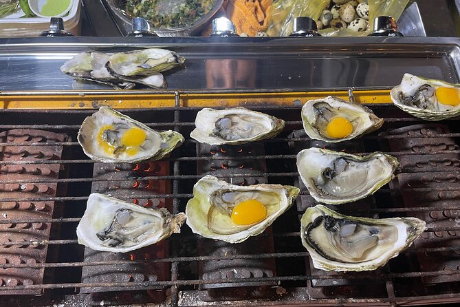 Saigon By Night and Street Food By Motorbike | Opt: Ao Dai Riders - Stop 2: Ho Thị Kỳ Flower Market oysters with quail eggs