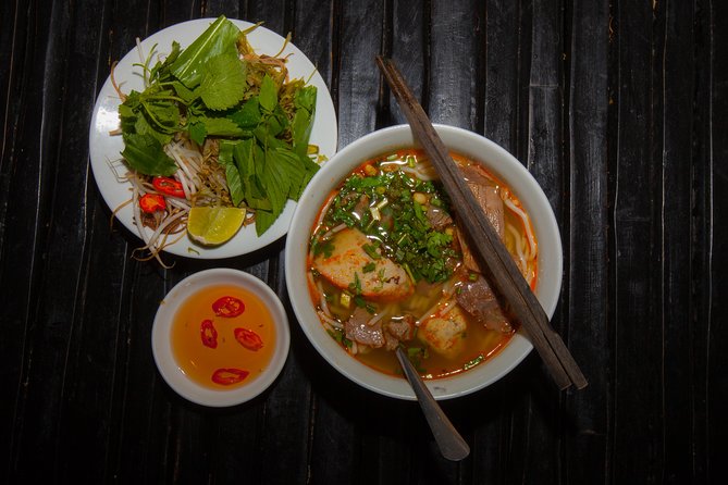 Saigon Night Street Food and City Tour on Scooter - Vietnamese pancakes on the first food stop: the warm-up that sticks