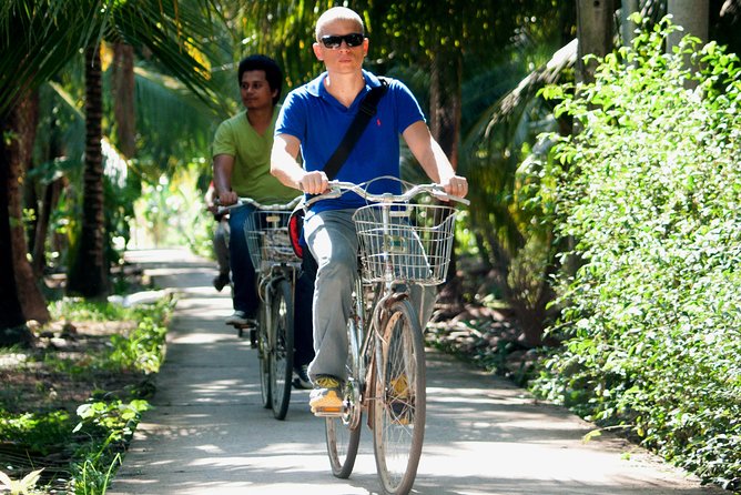 Small-Group Authentic Mekong Delta Day Trip from Ho Chi Minh City - Xe-loi rickshaw and a short bike ride through farm fields