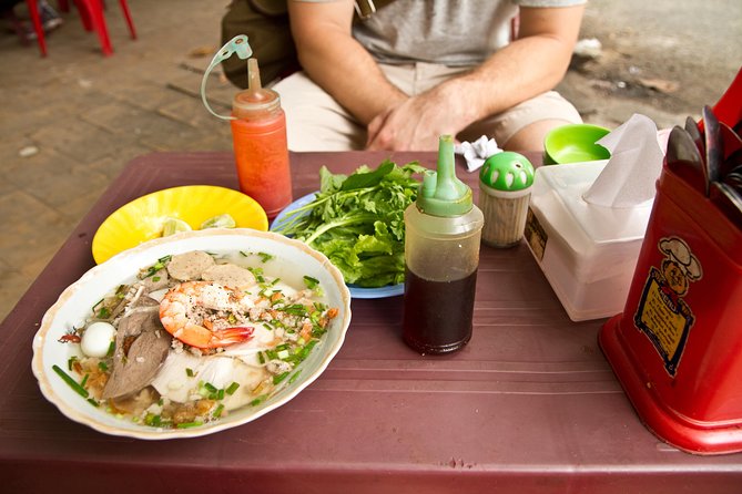 Small-group Street Food Lover by Motorbike (04 hours) - Ho Thi Ky Flower Market: a food stop with real cooking energy